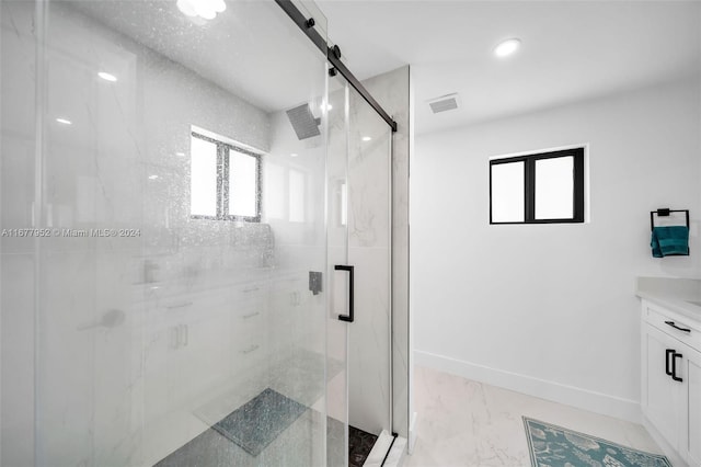 bathroom with vanity and an enclosed shower