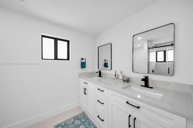 bathroom with tile patterned flooring and vanity