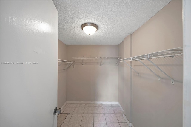 walk in closet featuring light tile patterned floors