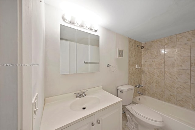 full bathroom featuring vanity, toilet, and tiled shower / bath combo