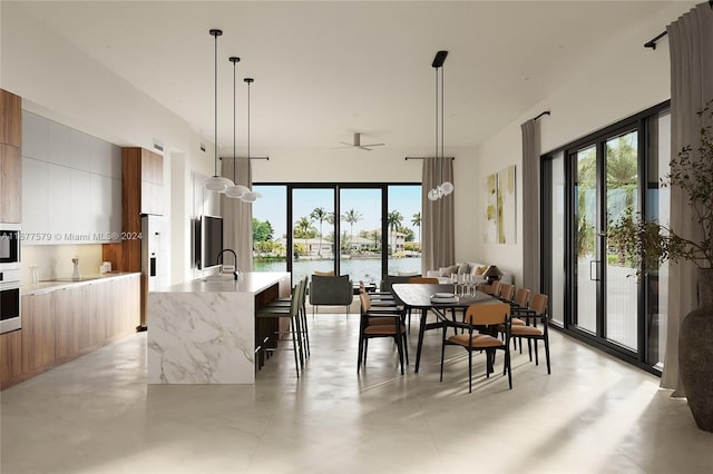 dining area featuring sink and a water view