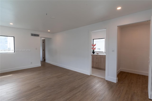 empty room with hardwood / wood-style flooring