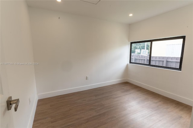 empty room with hardwood / wood-style floors