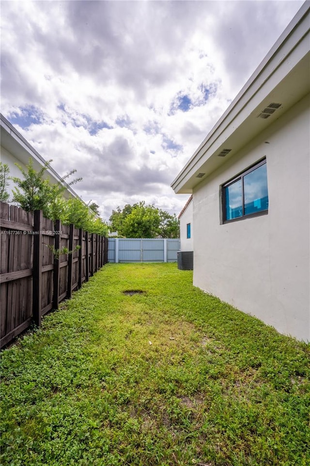 view of yard with central AC unit