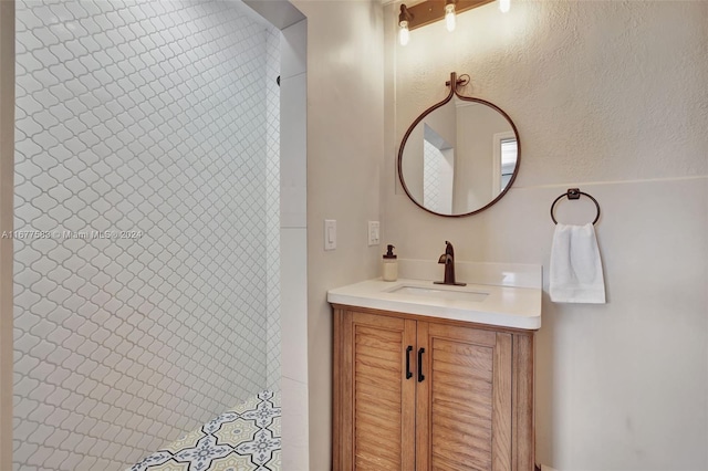 bathroom featuring vanity and curtained shower