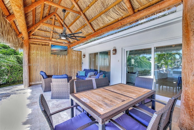 view of patio / terrace with a gazebo, an outdoor living space, and ceiling fan