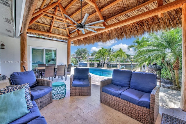 view of patio / terrace featuring a gazebo, an outdoor living space, and ceiling fan