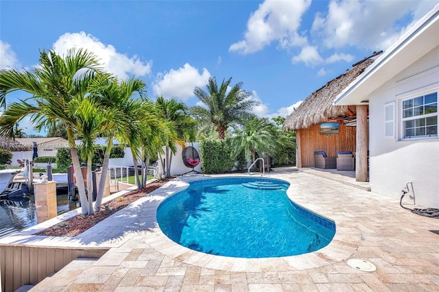 view of swimming pool featuring a patio area