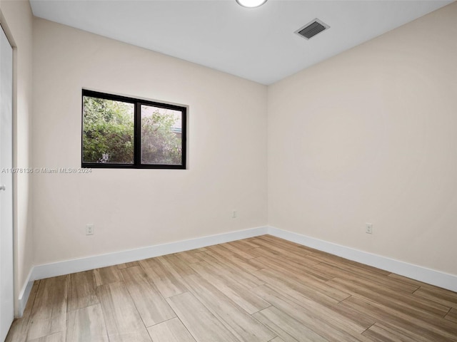 unfurnished room featuring light hardwood / wood-style flooring