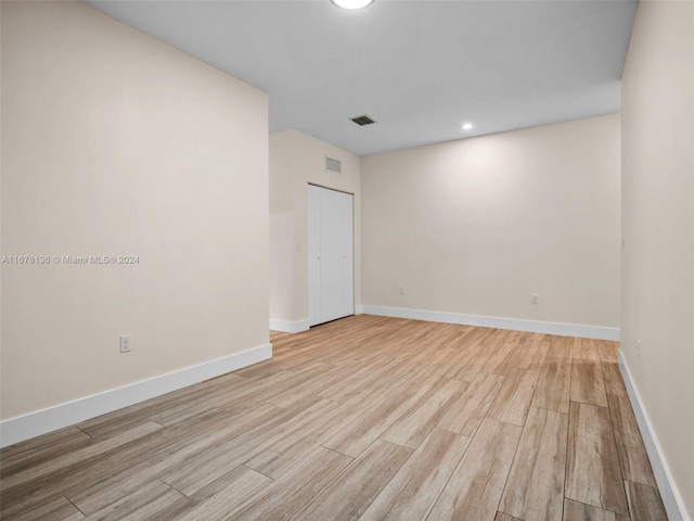 unfurnished room featuring light wood-type flooring