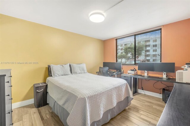 bedroom with light wood-type flooring