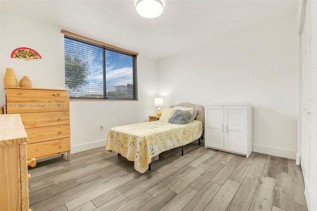 bedroom with light wood-type flooring