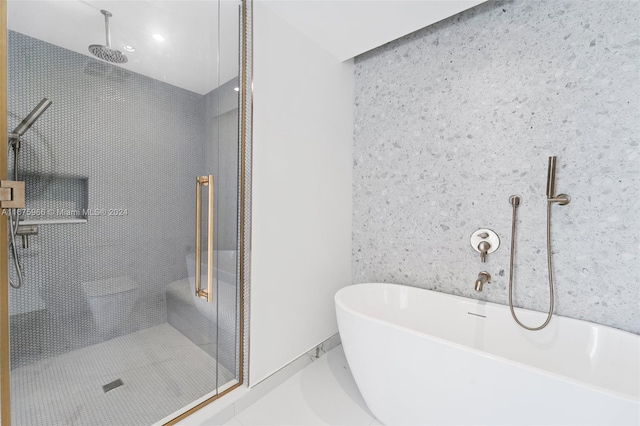 full bathroom with a freestanding bath and a stall shower