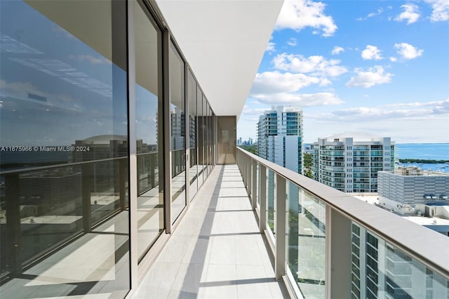 balcony featuring a water view