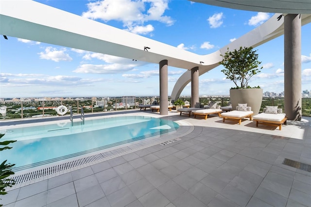 view of swimming pool featuring a patio area