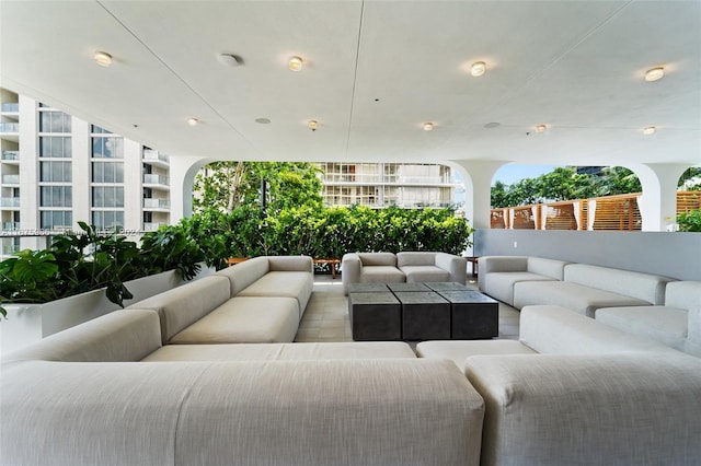 view of patio with an outdoor living space and a balcony