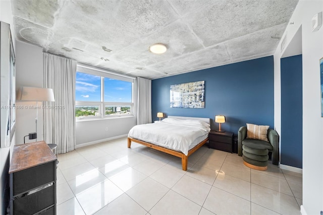 bedroom with light tile patterned floors