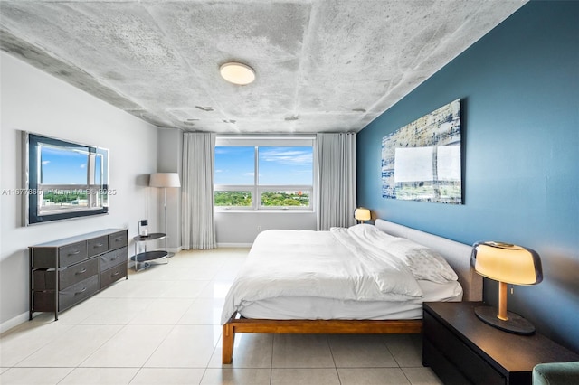 bedroom featuring light tile patterned floors