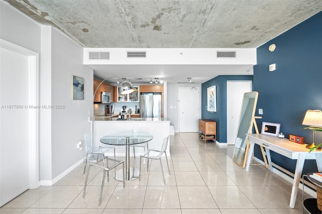 tiled dining area with sink