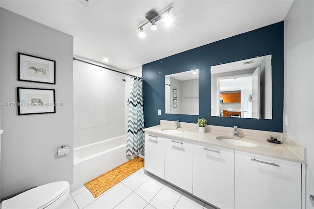 full bathroom with vanity, tile patterned floors, toilet, and shower / bath combo