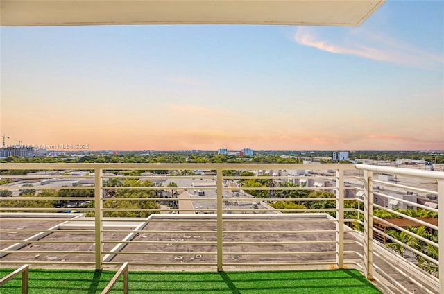 view of balcony at dusk