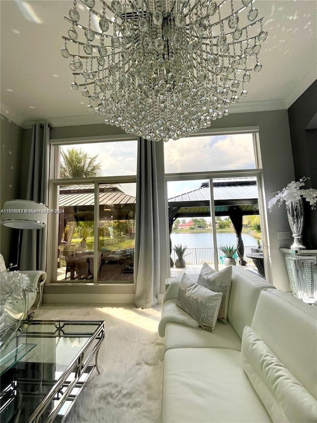 interior space with an inviting chandelier, crown molding, and a water view