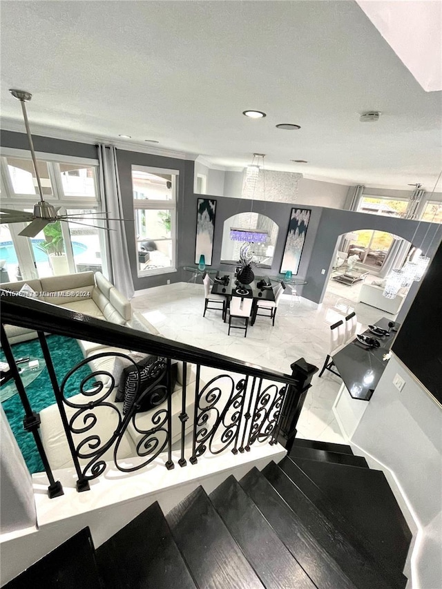 staircase featuring a textured ceiling