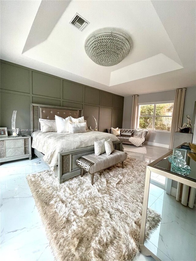 bedroom with a raised ceiling