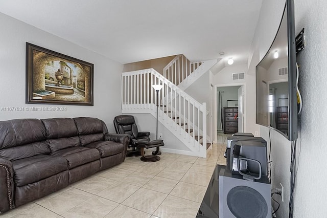 living room featuring light tile patterned flooring and vaulted ceiling