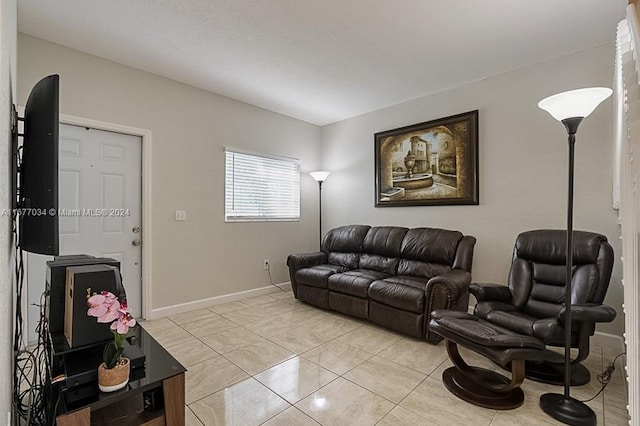 living room with light tile patterned floors