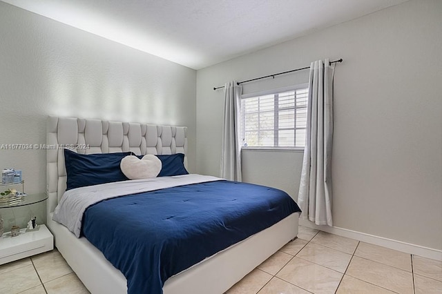 bedroom with light tile patterned flooring