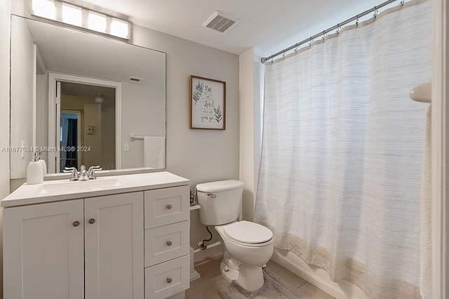 full bathroom featuring vanity, shower / bath combination with curtain, and toilet