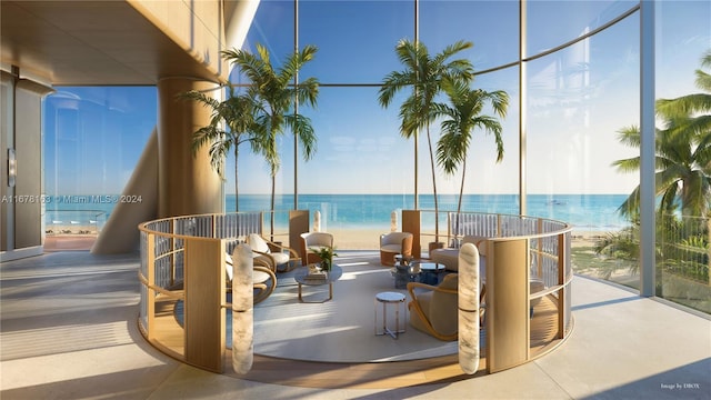 view of patio / terrace featuring a water view and a beach view