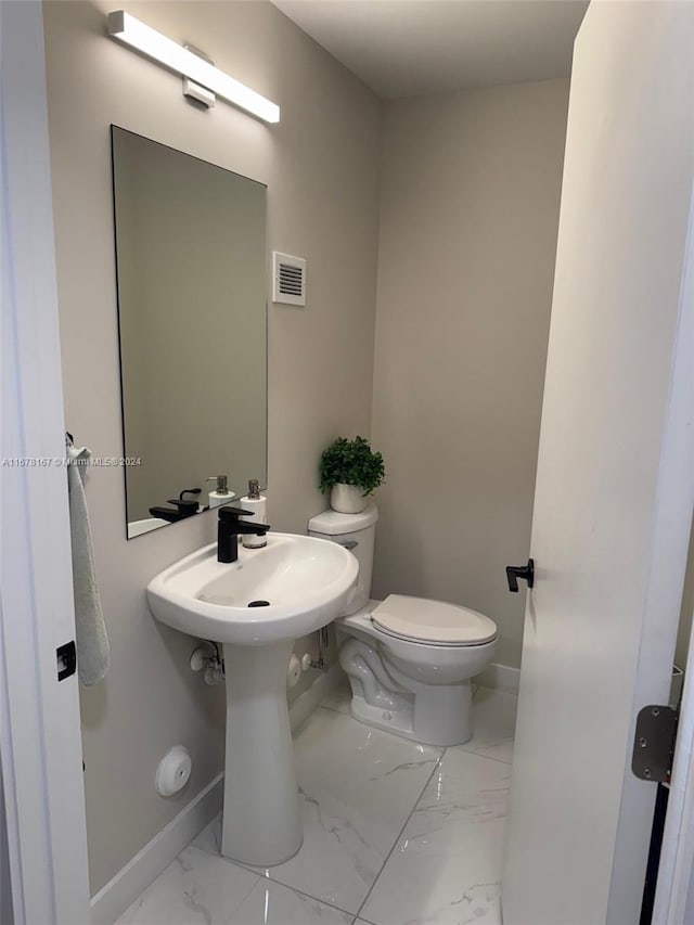 bathroom featuring toilet