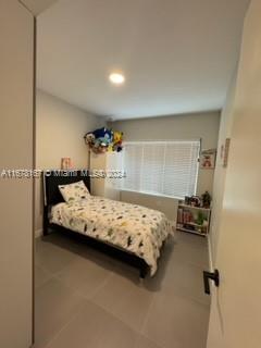 bedroom with tile patterned flooring