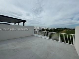 view of patio with a balcony