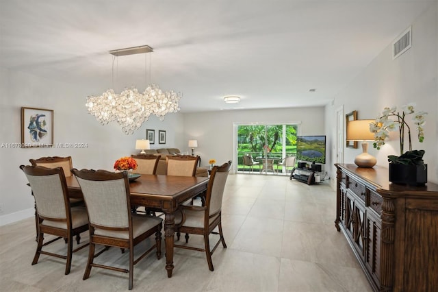 dining room featuring a notable chandelier