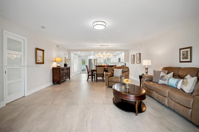 living room featuring an inviting chandelier