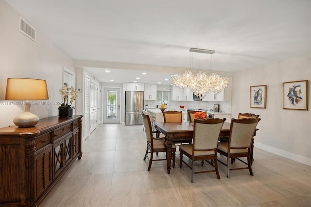 dining space with a chandelier