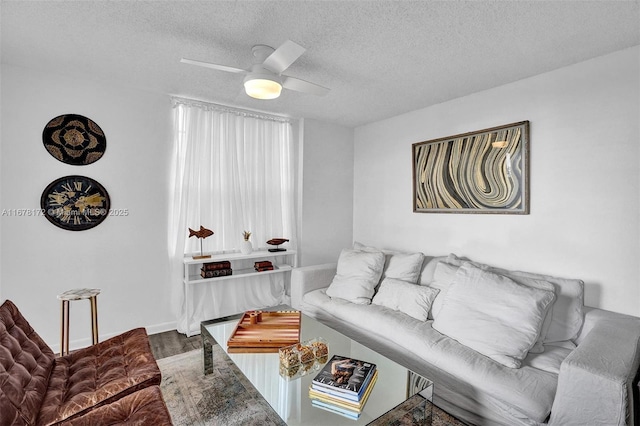 living room with wood-type flooring, a textured ceiling, and ceiling fan