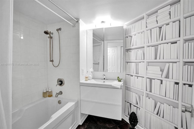 bathroom with vanity and tiled shower / bath