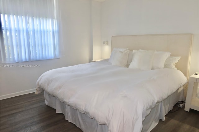 bedroom featuring dark hardwood / wood-style floors