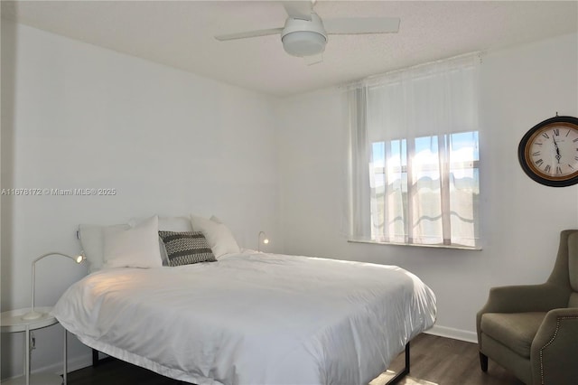 bedroom featuring dark hardwood / wood-style floors and ceiling fan