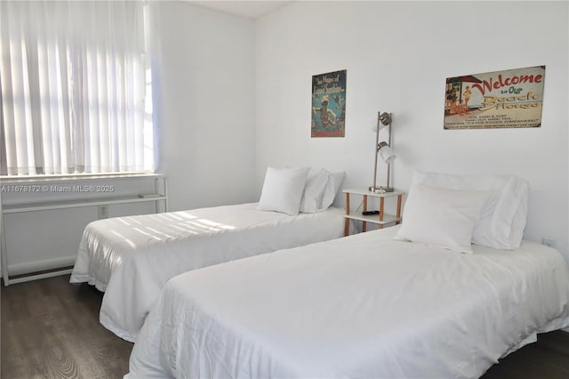 bedroom featuring dark hardwood / wood-style flooring