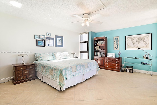 5550 N Ocean Dr Unit 8B, Singer Island, FL 33404 - bedroom with a textured ceiling, light tile patterned floors, and a ceiling fan