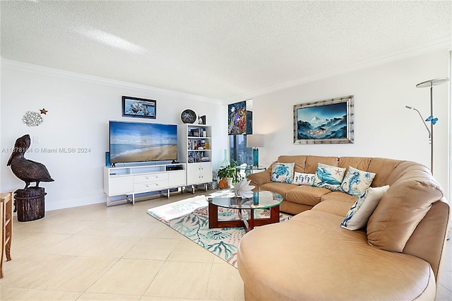 tiled living room with a textured ceiling and ornamental molding