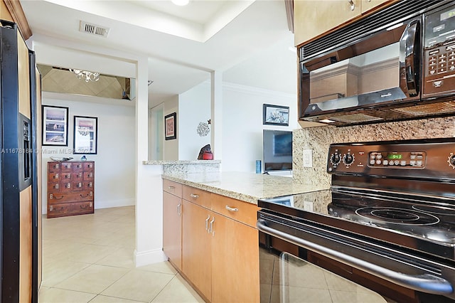 5550 N Ocean Dr Unit 8B, Singer Island, FL 33404 - kitchen with black appliances, light tile patterned floors, light stone countertops, and ornamental molding
