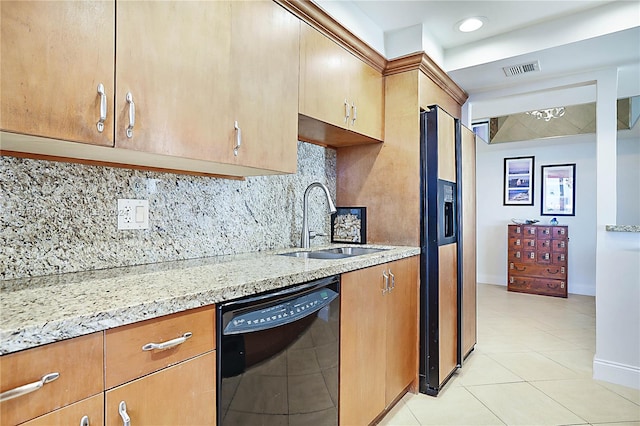 kitchen with fridge with ice dispenser, backsplash, black dishwasher, light tile patterned floors, and sink