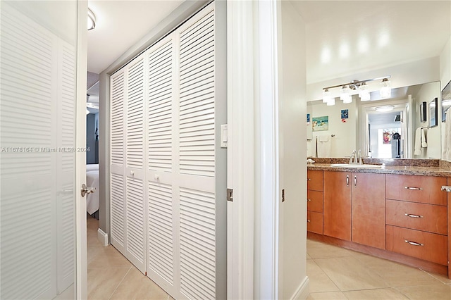 5550 N Ocean Dr Unit 8B, Singer Island, FL 33404 - hall with light tile patterned floors and a sink
