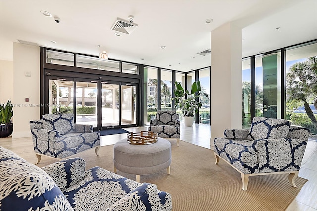 5550 N Ocean Dr Unit 8B, Singer Island, FL 33404 - living room with floor to ceiling windows, wood finished floors, and recessed lighting